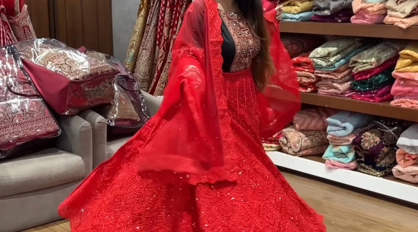 Priyanka Nayak lehenga journey showcasing vibrant red lehenga with intricate designs in JMS Studio