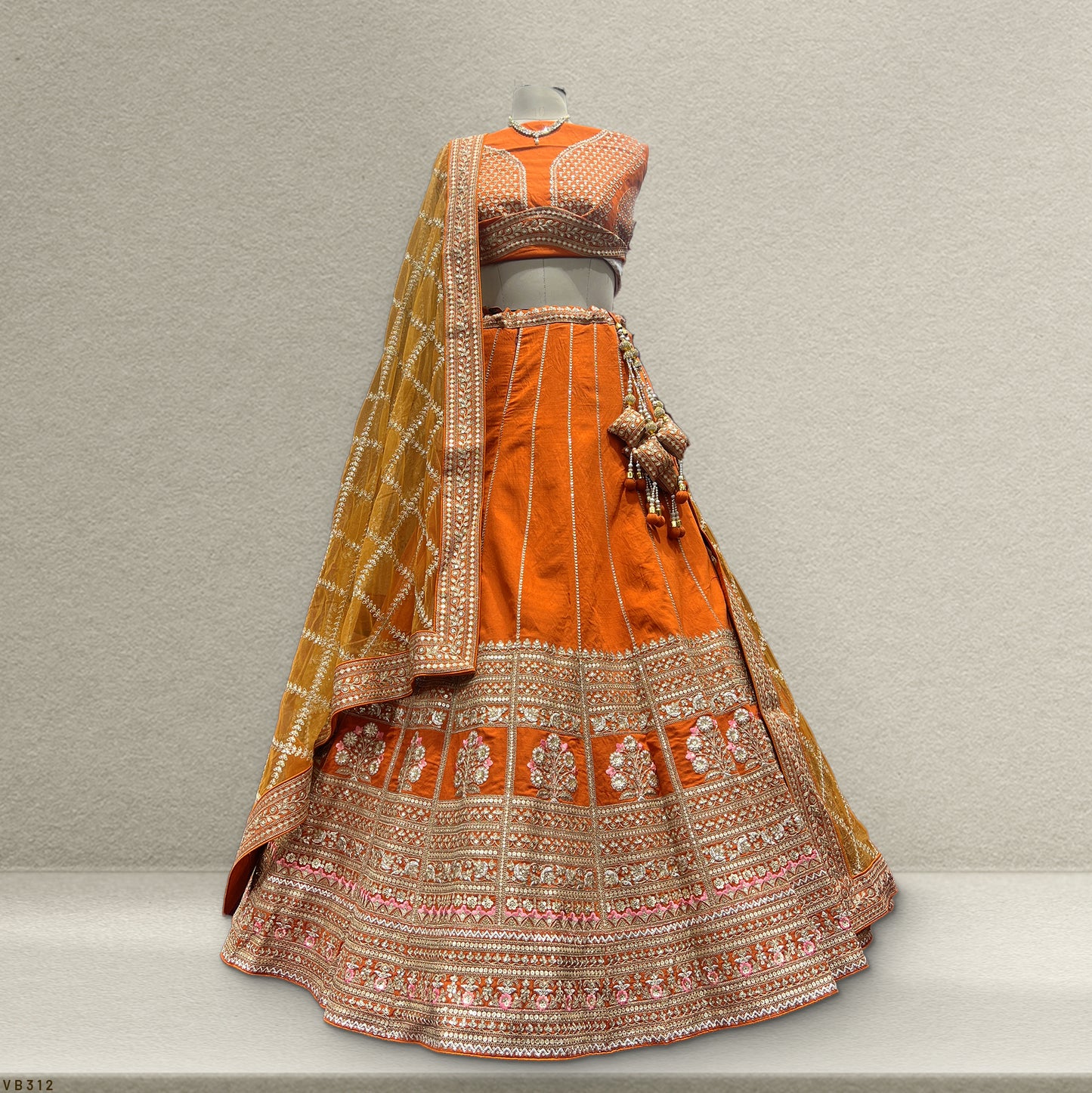 Dulhan in Orange Lehenga Elegance: Celebrity-Inspired Royal Baggi Collection - JMS Studio