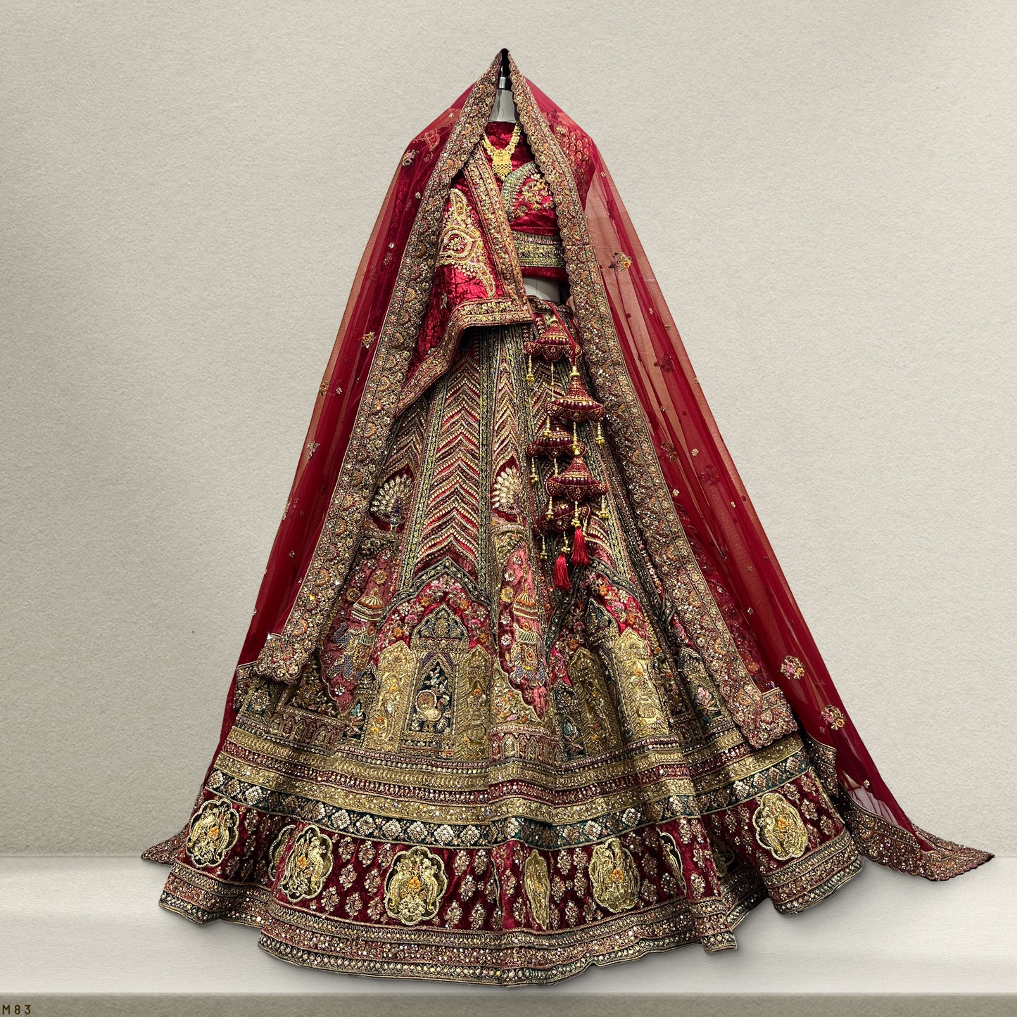 Stunning velvet maroon bridal lehenga with intricate embellishments and matching dupatta for elegant weddings