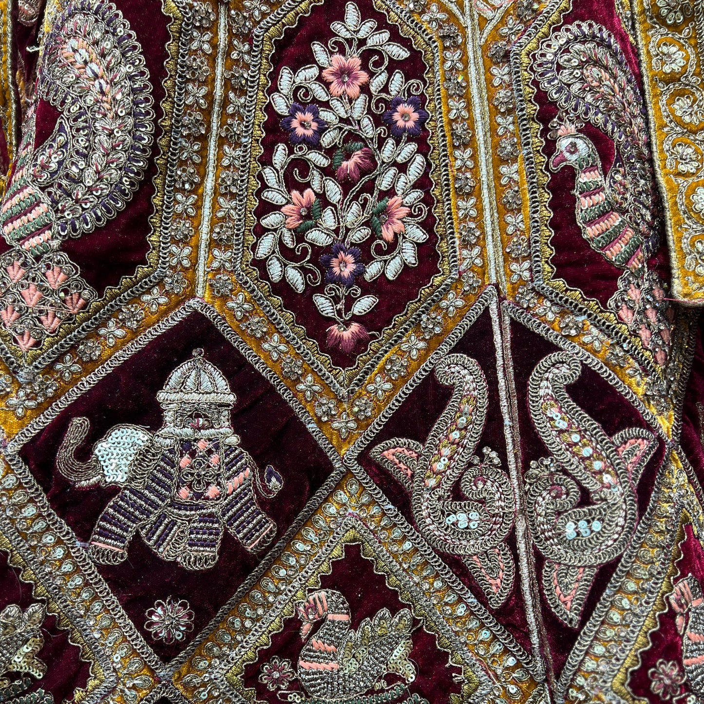 Luxurious velvet gold bridal lehenga showcasing intricate embroidery and vibrant colors from JMS Studio