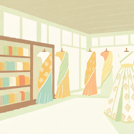 Showcasing a vibrant collection of designer sarees online in an elegant boutique setting
