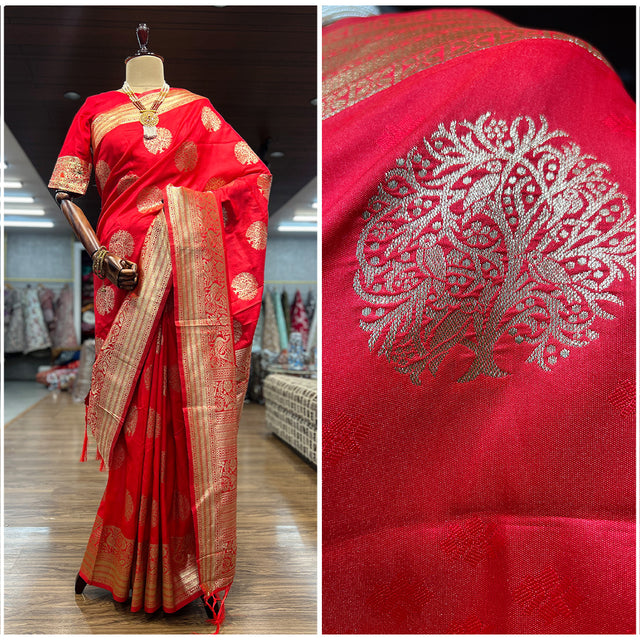 Red woven saree with golden zari border and ornate leaf motifs in silver tones