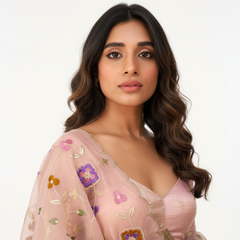 Light pink V-neck blouse with floral thread embroidery and sequin motifs on sheer sleeves
