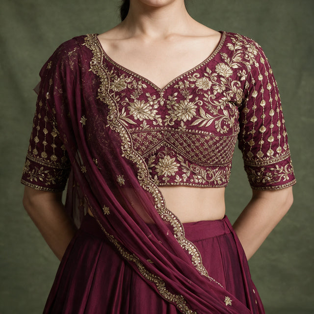 Wine choli blouse with gold thread embroidery, sequins, and V-neck