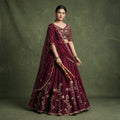 Wine chaniya choli lehenga set with gold rangoli thread embroidery and sequins