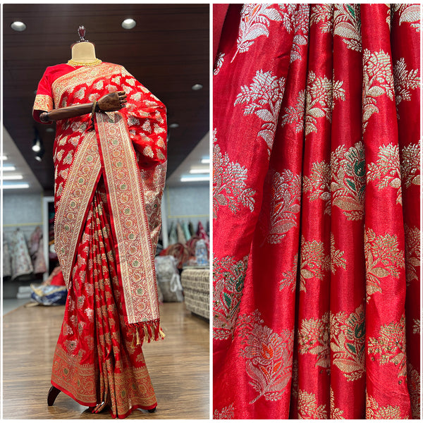 Red woven saree fabric with golden zari leaf motifs and textured sheen