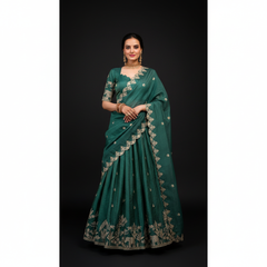 Teal lehenga choli with gold thread embroidery, scalloped neckline and draped dupatta