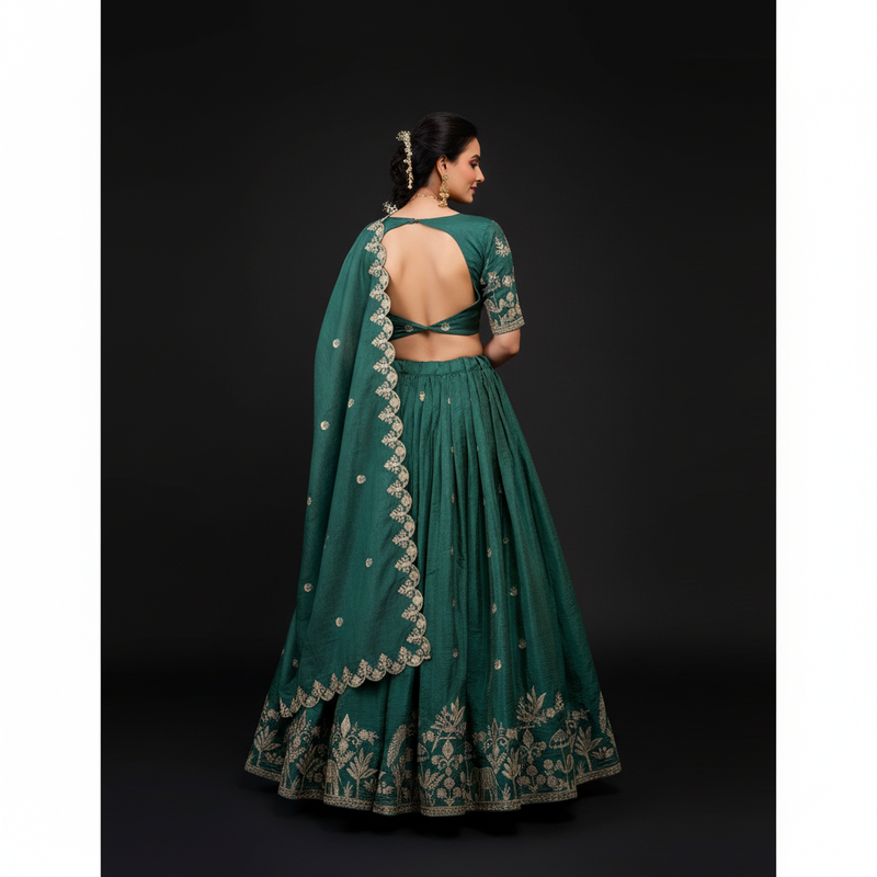 Back view of teal lehenga choli with gold sequin embroidery on blouse and skirt
