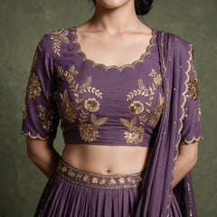 Doli lavender embroidered blouse with scalloped neckline, gold zari floral work and pleated skirt waistband