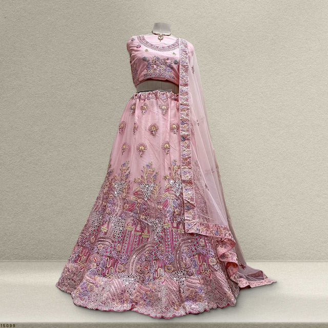 Embroidered pink lehenga with long-sleeve blouse and sheer dupatta, floral zari motifs