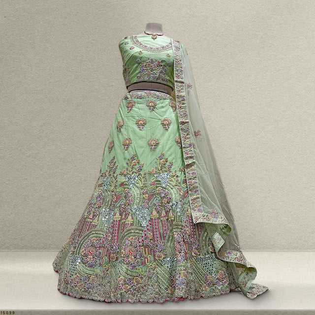 Mint green embroidered lehenga with multicolor floral motifs and sheer dupatta