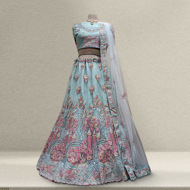 Embroidered light blue lehenga with pink floral motifs and sheer matching dupatta