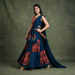 Side-back view of the navy and red chaniya choli in a twirl with the dupatta trailing behind