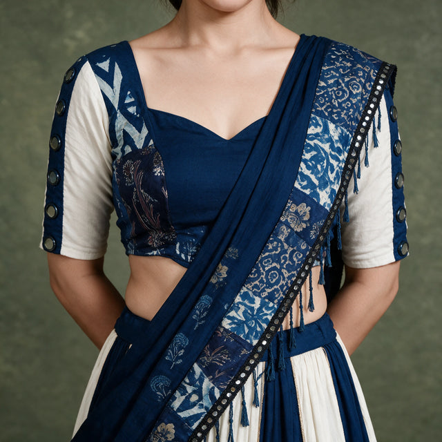 Close-up of the navy blouse with printed indigo sleeves, mirror discs and the navy dupatta with a printed mirror-laced border
