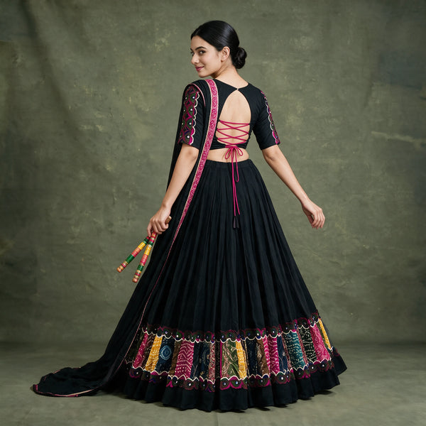 Back view of the black chaniya choli with tie-up back blouse and multicolour patchwork panels around the hem