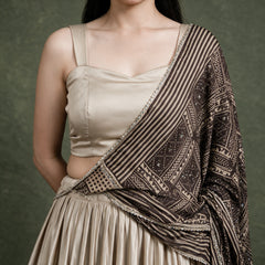 Beige satin choli with embellished neckline and dark striped printed dupatta