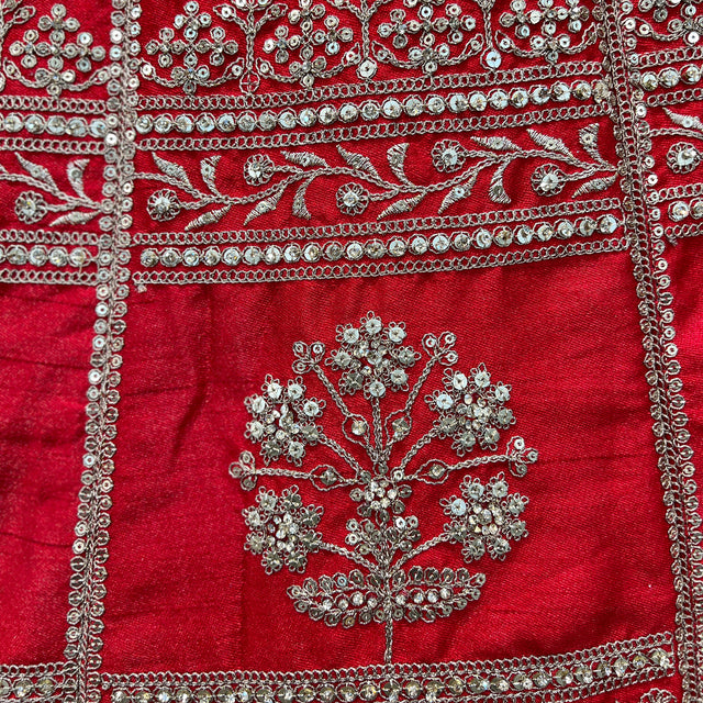 Red raw silk bodice panel with silver floral embroidery and layered chain borders
