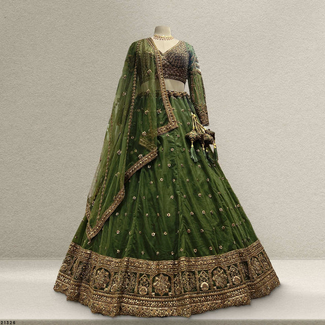Bottle green lehenga with gold embroidered border and allover motifs, flared skirt