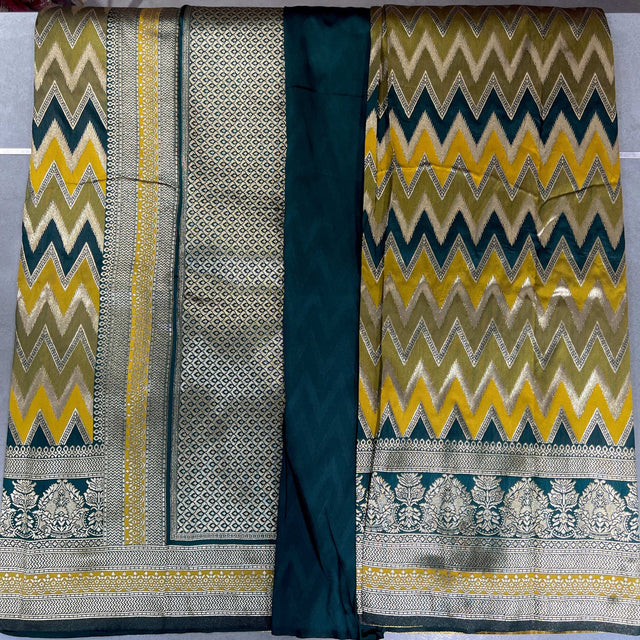 Teal and gold silk saree with zigzag chevron pattern and jacquard border panel