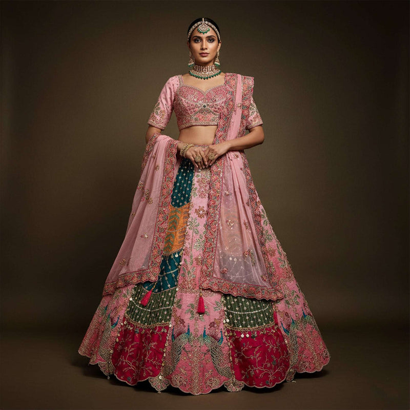 Pink embroidered lehenga with matching blouse and sheer dupatta drape