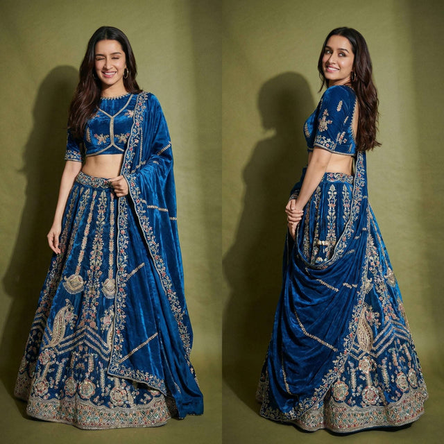 Blue embroidered lehenga with matching blouse and dupatta, flared skirt with ornate border