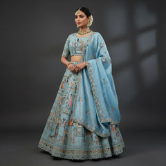Sky blue lehenga set with embroidered blouse, floral motifs, and draped dupatta