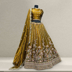 Gold lehenga skirt with pink and blue floral embroidery border, plus matching dupatta