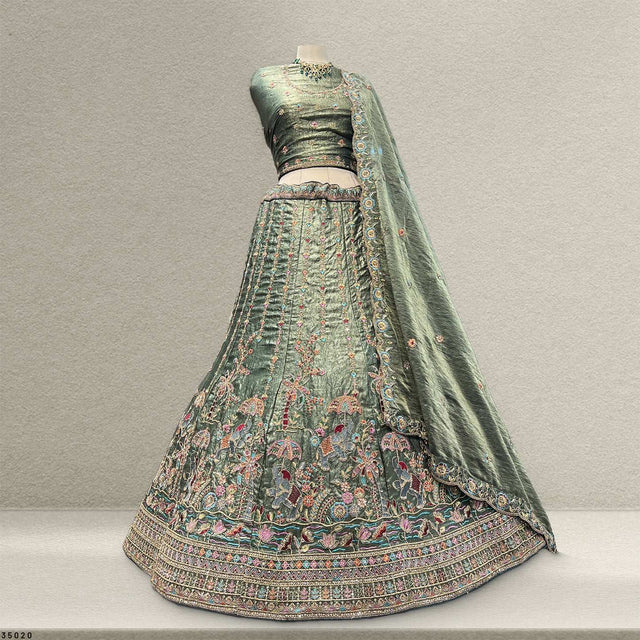 Olive green lehenga skirt with ornate multicolor embroidery and wide patterned hem border