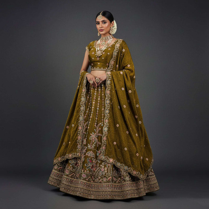 Golden-brown tissue silk lehenga with embroidered blouse and draped dupatta
