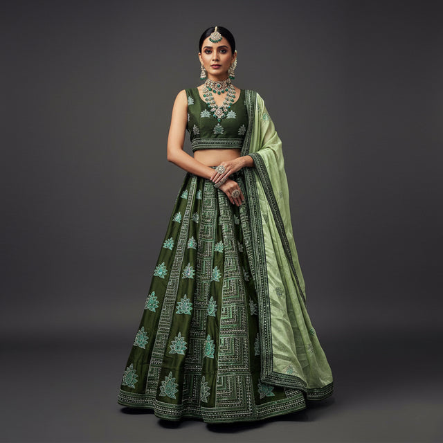 Green georgette lehenga with sleeveless blouse, floral motifs, full skirt and matching drape
