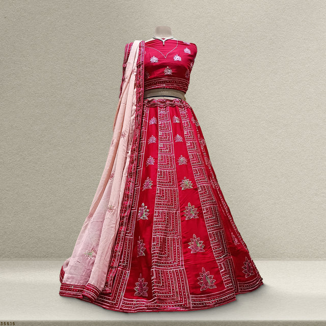 Fuchsia pink lehenga set with long blush dupatta and embroidered full skirt on mannequin