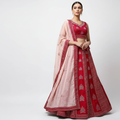 Fuchsia pink lehenga set with embroidered blouse, full skirt, and blush dupatta
