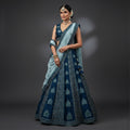 Blue georgette lehenga with dark blue blouse, silver border and draped teal dupatta