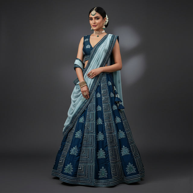 Blue georgette lehenga with dark blue blouse, silver border and draped teal dupatta