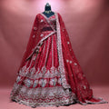 Cherry red raw silk bridal lehenga with silver sequin borders and double dupatta