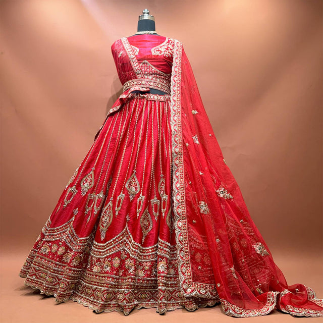 Red raw silk bridal lehenga with pearl jhumar motifs, floral resham hem, organza and net dupattas
