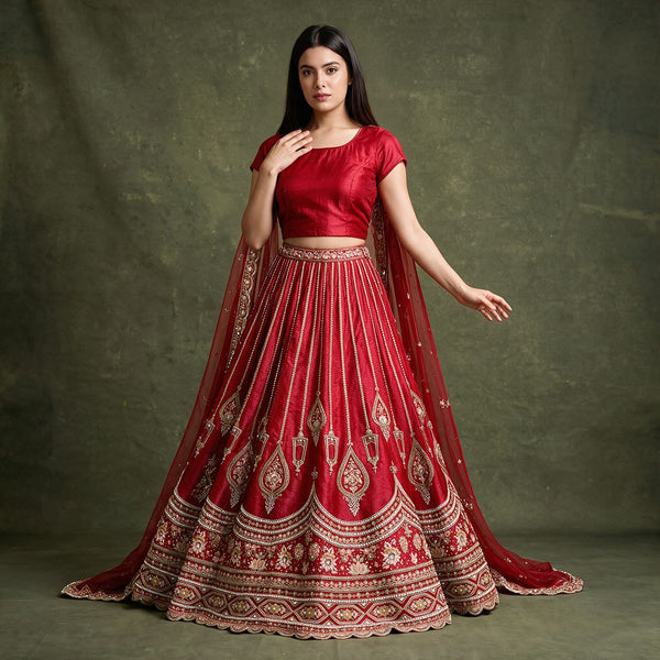 Red bridal lehenga with embroidered motifs and flowing dupatta