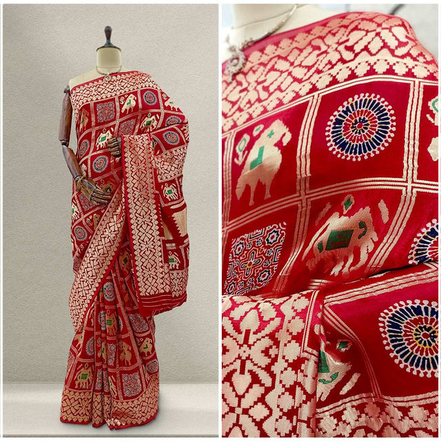 Red silk saree with decorative patchwork motifs and border, draped on mannequin.