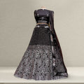 Black sequined lehenga set with silver floral embroidery and matching dupatta