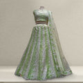 Green sequin embroidered lehenga with sheer matching dupatta