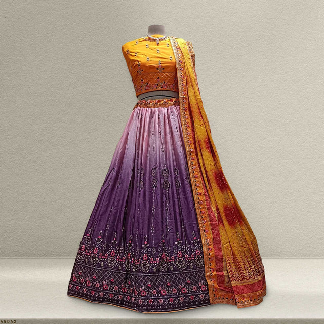 Embroidered purple lehenga with orange blouse and multicolor bandhej dupatta