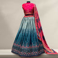 Multicolor silk work lehenga with teal skirt, pink bodice, and embroidered dupatta