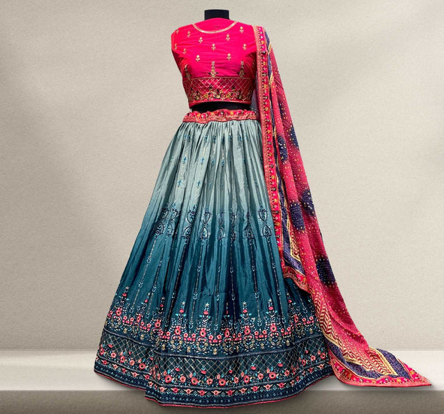 Multicolor silk work lehenga with teal skirt, pink bodice, and embroidered dupatta