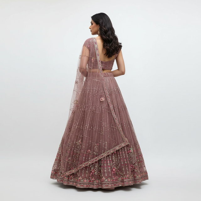 Cinnamon-pink embroidered lehenga with sheer back dupatta and wide hem border
