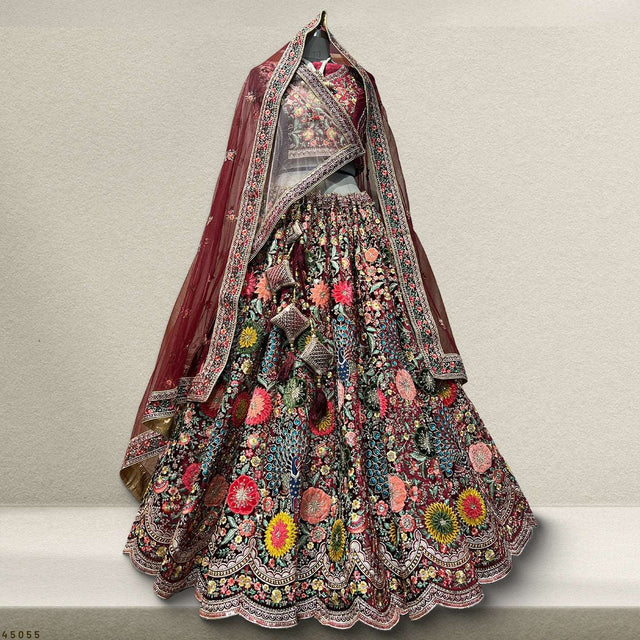 Maroon velvet lehenga with multicolor embroidered dupatta and flared skirt