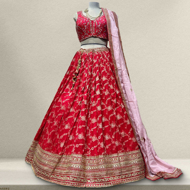 Red flared lehenga skirt with embroidered gold hem border and pink organza dupatta