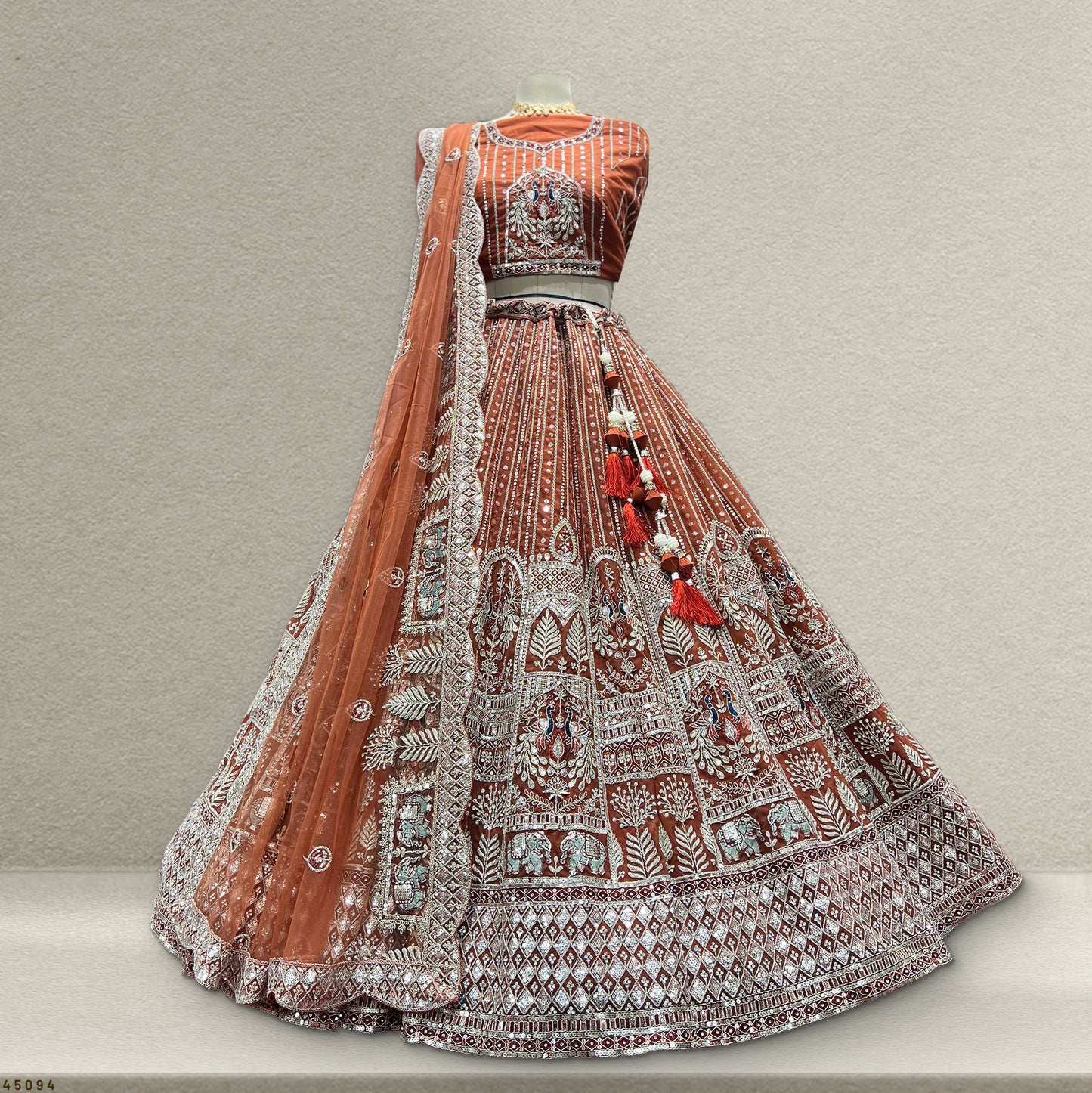 Cherry Blossom - The Elephant Peacock Partywear Designer Lehenga Burnt Orange Color