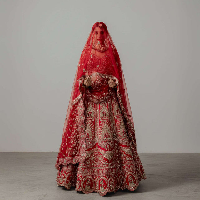 Red bridal lehenga with double dupatta and scalloped hem embroidery