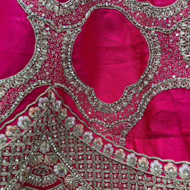 Rani pink blouse with cutout teardrop motif and heavy silver-toned beadwork