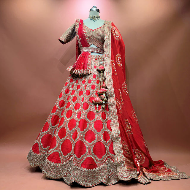 Royal red bridal lehenga with silver pattern and flowing dupatta, flared skirt